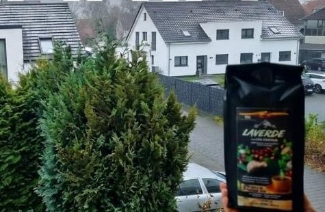 A bag of our Colombian coffee held up in a German suburb