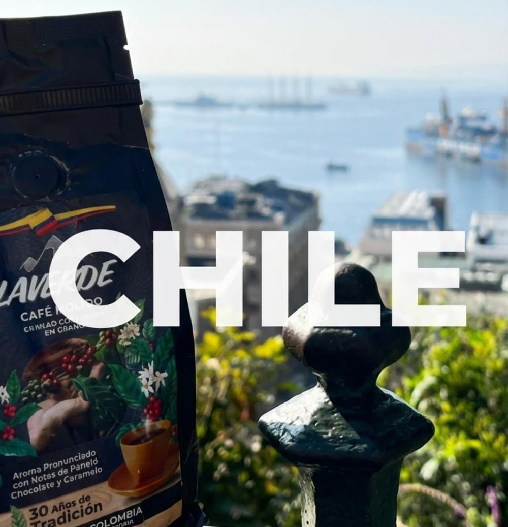 A bag of our Colombian coffee held over the harbour of Valparaíso, Chile